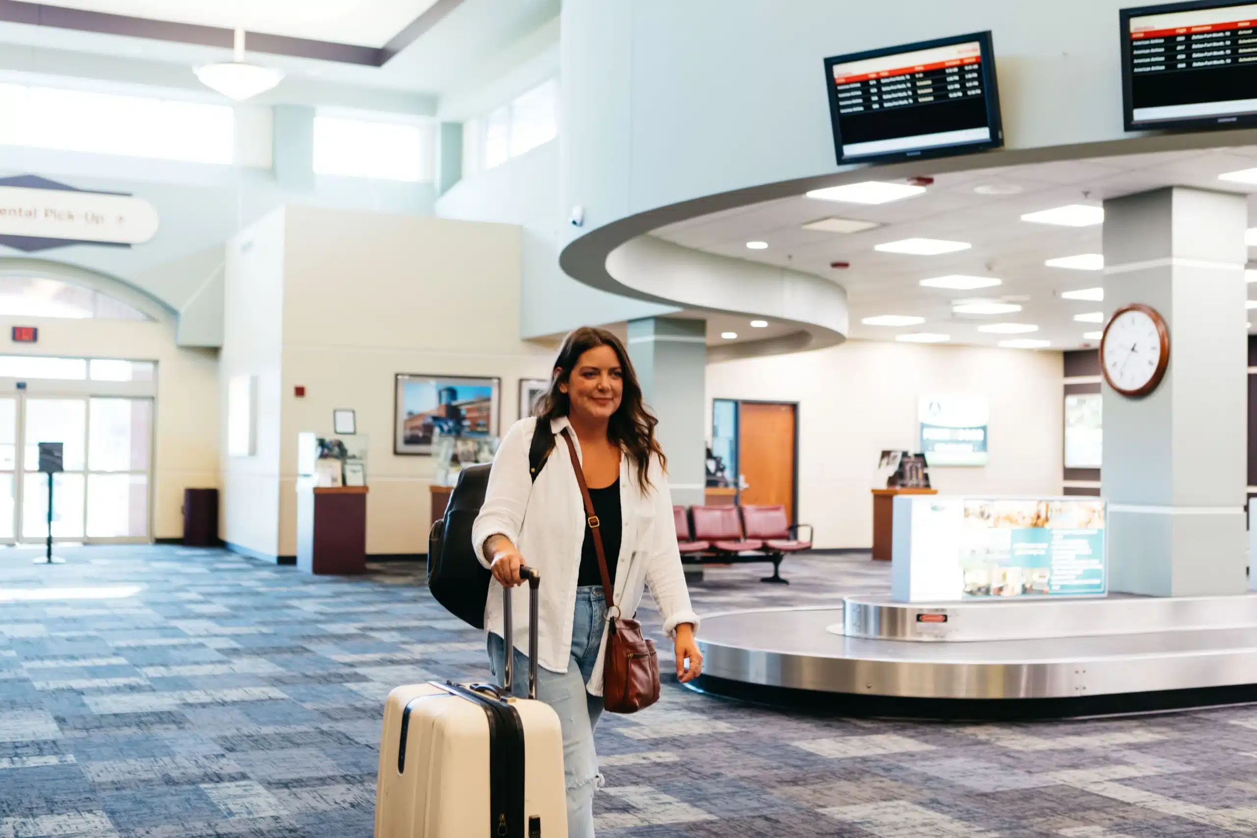 woman walking through the Fort Smith Regional Airport